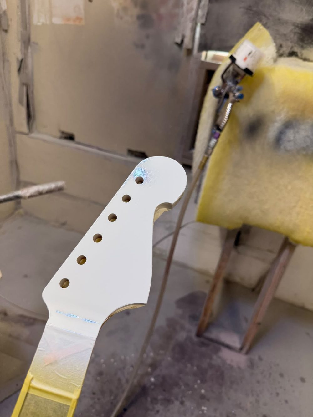 Freshly painted headstock of the handcrafted guitar
