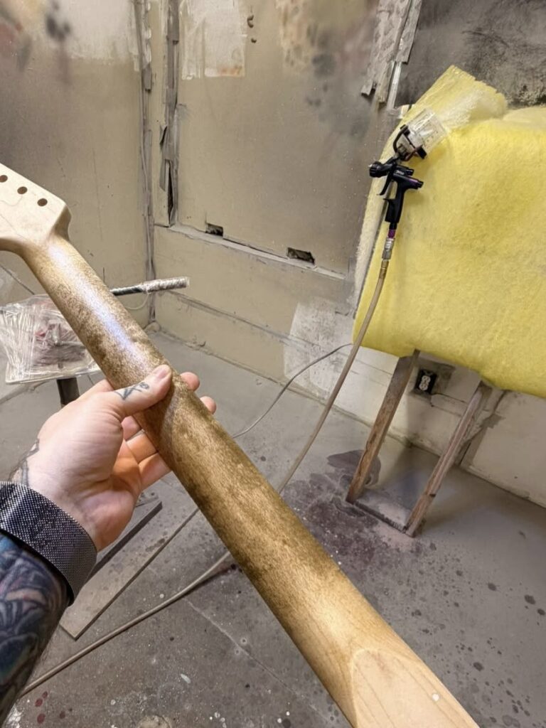 Raw guitar neck in the shop